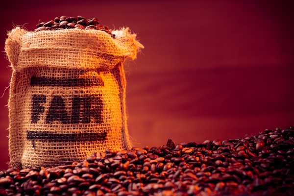 Fairtrade fortnight. Cloth bag of coffee beans with the words Fair written on it.