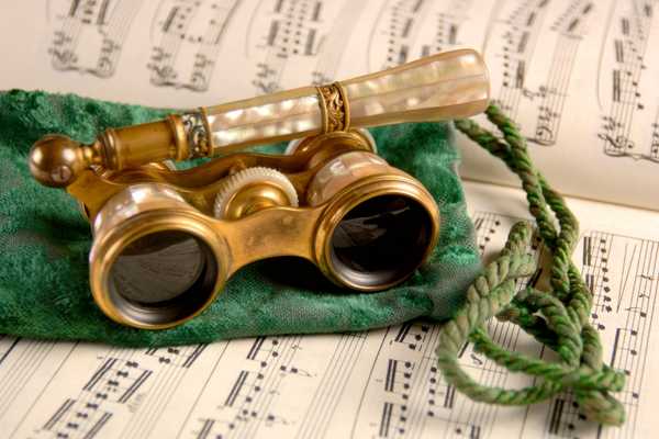 Opera Day. Opera binoculars sitting on a sheet of music