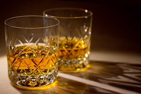 International Scotch Day. Two crystal scotch glasses sitting side by side