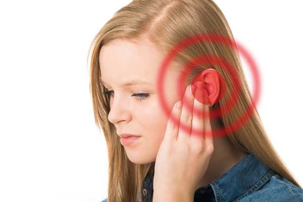 Tinnitus Awareness Week. Lady holding her ear and red target covering the ear