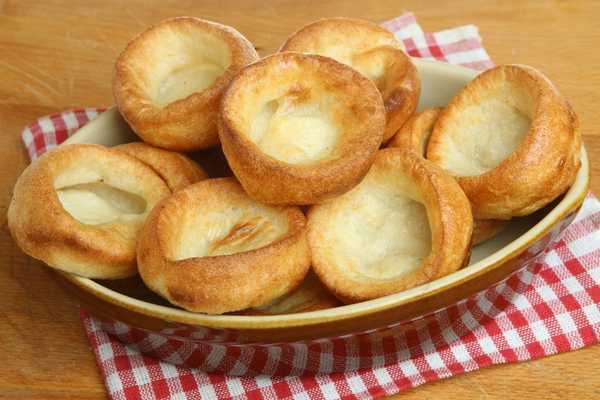 Yorkshire Pudding Day. A bowl of yorkshire puddings sitting on a red and white checked cloth