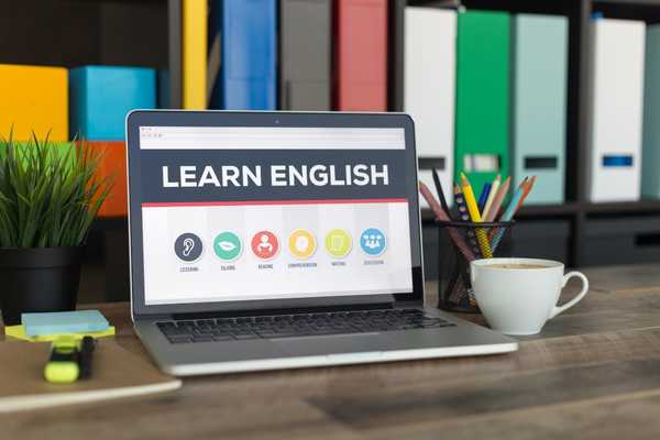 Laptop saying learn English for English Language Day