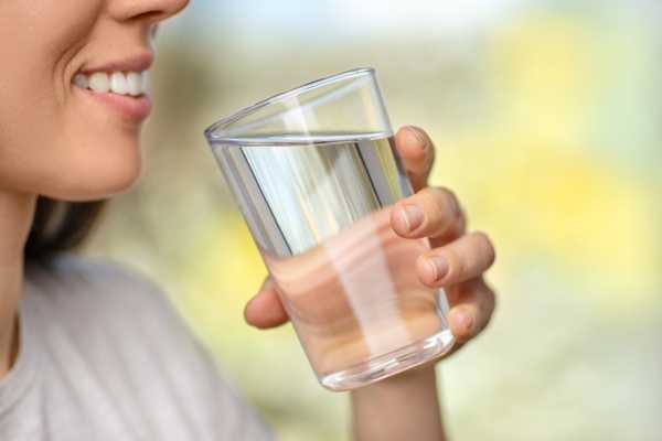 Person drinking a glass of water for Hydration Day