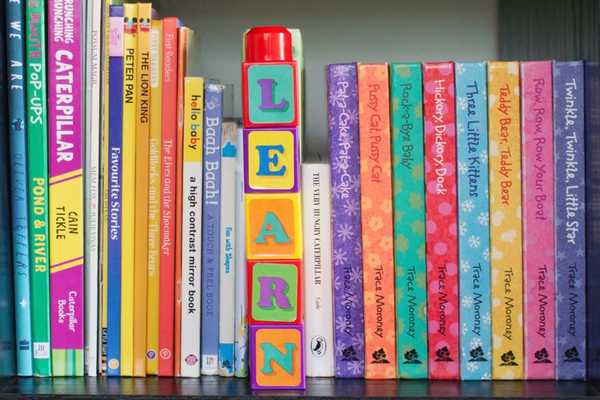 Children's books on a bookshelf for International Children's Book Day