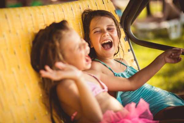 Two children laughing for National Limerick Day