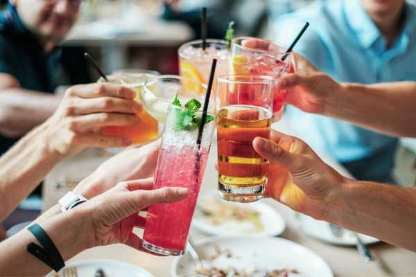 People raising the glasses when out for a meal for Taste of London Festival