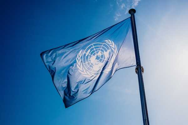 UNICEF flag flying against a blue sky for UNICEF Day for Change