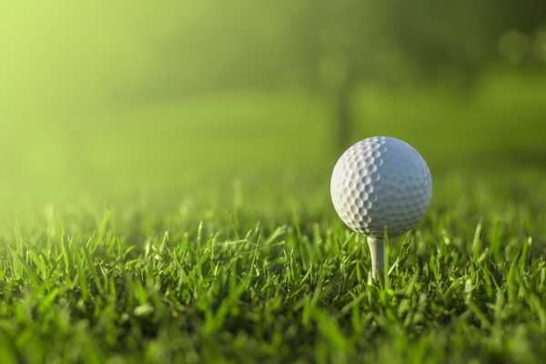 Golf ball on a tee on a golf course for start of US Masters (Golf)