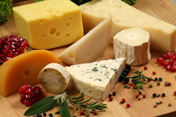 Different varieties of cheese on a board for World Cheese Day