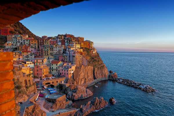 Hillside seaside village in Italy for World Heritage Day