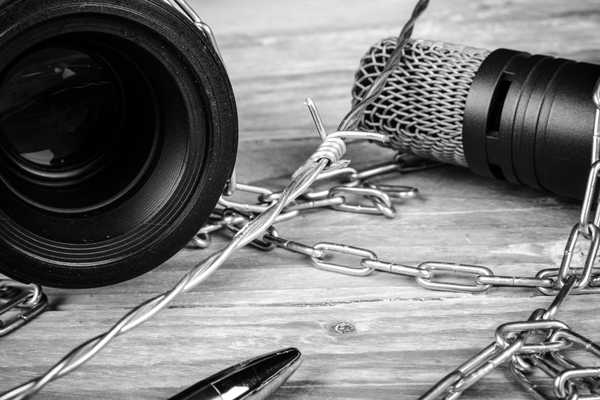 Microphone with chains around it for World Press Freedom Day