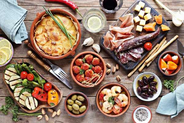 Tapas portions laid out on a table for World Tapas Day