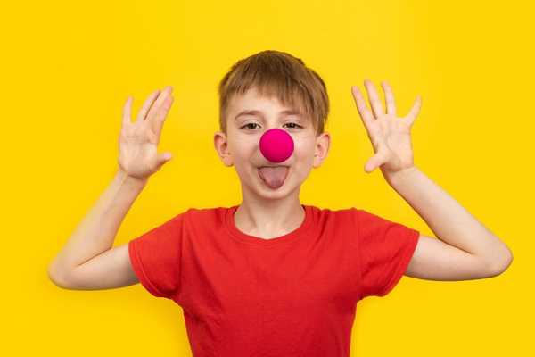 Image of boy with red nose on for Comic Relief / Red Nose Day
