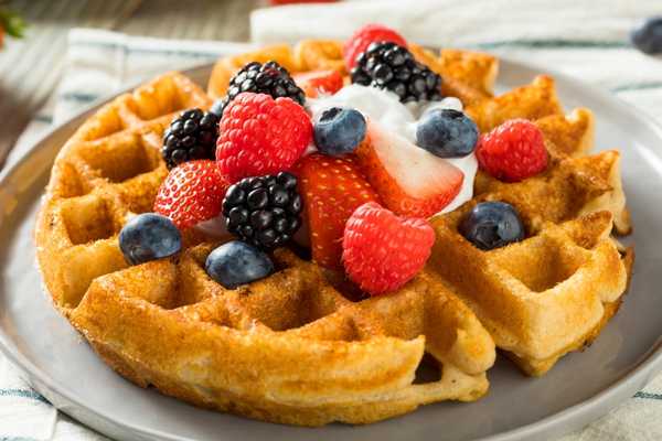 Waffle with berries and cream for International Waffle Day