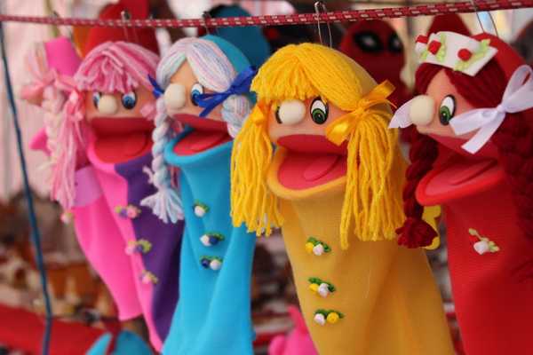 Colourful puppets with their mouths open for World Puppetry Day