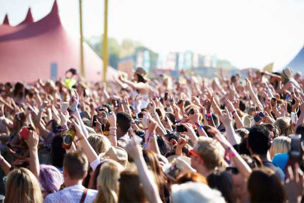 Crowd cheering at an outside festival for Forbidden Fruit Festival