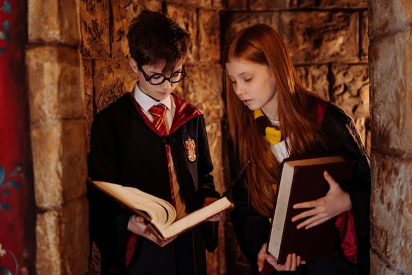 Harry Potter and Hermione Granger looking at spell book for Harry Potter's Birthday