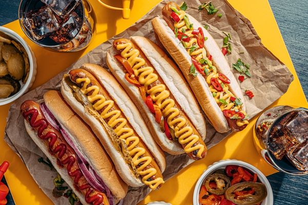 Hot dogs with yellow mustard on top for Hot Dog Day