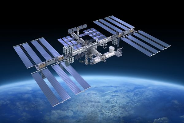 Space station floating in the universe for Space Exploration Day