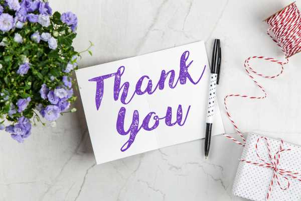 Thank you card with purple flowers beside it for Thank You Day