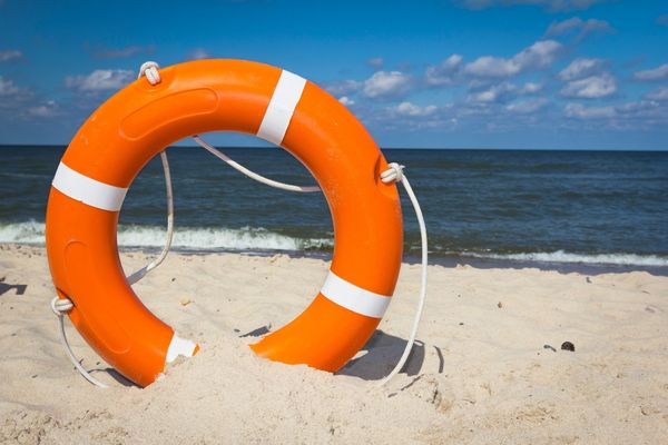Life ring in the sand for World Drowning Prevention Day