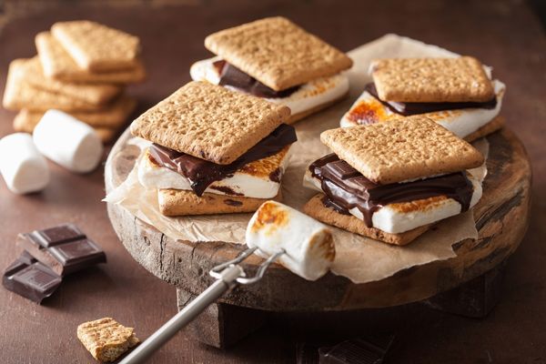Photo of smores. Chocolate biscuits with toasted marshmallows sandwiched in between for S'mores Day