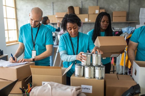 Volunteers packing food boxes for World Humanitarian Day