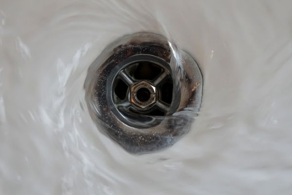 Water swirling down a drain for Blocktober