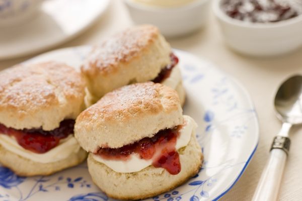 Plate of scones with jam and cream for British Food Fortnight