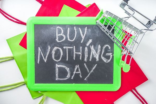 "Buy Nothing Day" written in white chalk on a blackboard for Buy Nothing Day