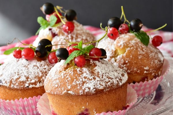 Victoria sponge cakes with summer fruit on top for National Cake Day