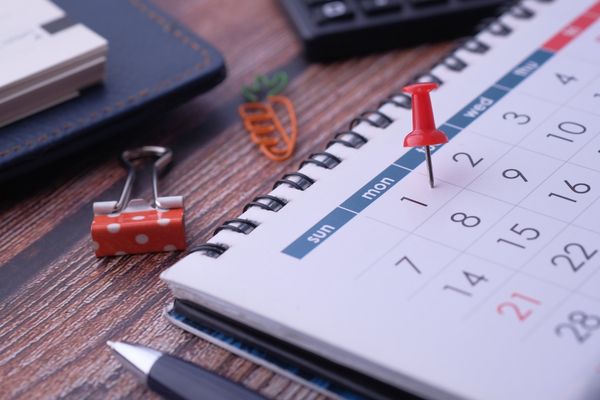 Desk calendar with red pin marking 1 September for Calendar Adjustment Day