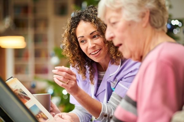 Woman helping an elderly woman for Carers Rights Day