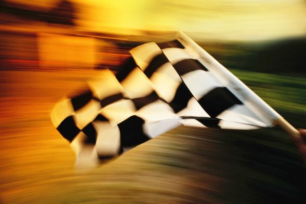 Black and White checkered flag waving for Goodwood Revival (Motor Sport)