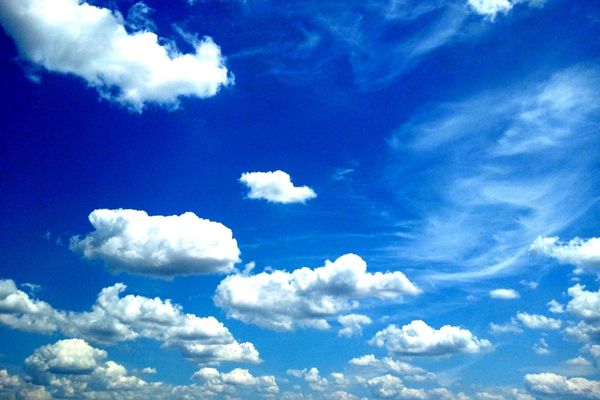 White clouds against a blue sky for International Day of Clean Air for Blue Skies