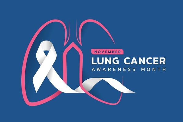 Blue background with a pink lung outline and a white ribbon. Text reads "Lung Cancer Awareness Month"