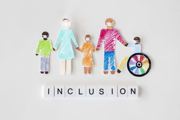 Drawing of 5 family members of different ages and abililites and the word "Inclusion" in Scrabble tiles underneath them for National Inclusion Week