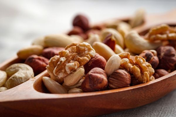 Array of different types of nuts in a bowl for National Nut Day