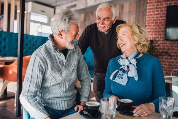 3 elderly people laughing together for Positive Ageing Week