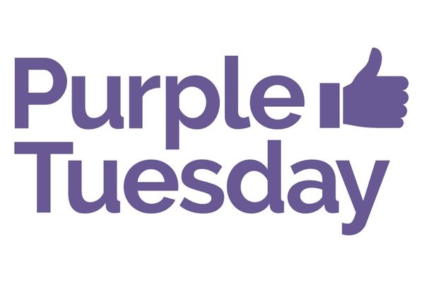 Purple graphic of a thumbs up sign with text reading "Purple Tuesday"