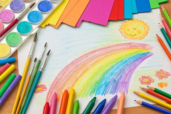 Drawing of a rainbow surrounded by colourful drawing materials for The Big Draw