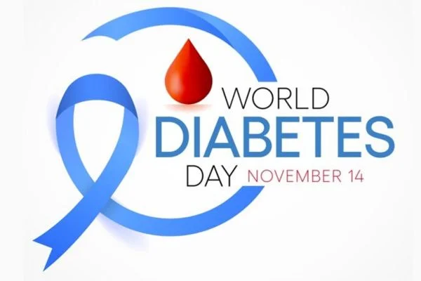 Blue ribbon with a drop of red blood. Text reads: "World Diabetes Day, November"