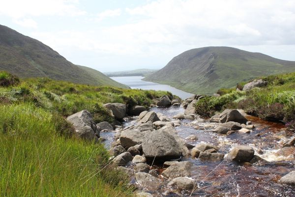 Mountains and rocks overlooking a river for World Rivers Day