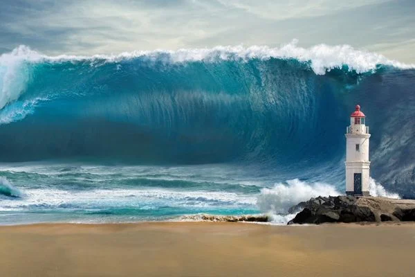 Tsunami approaching a beach for World Tsunami Awareness Day