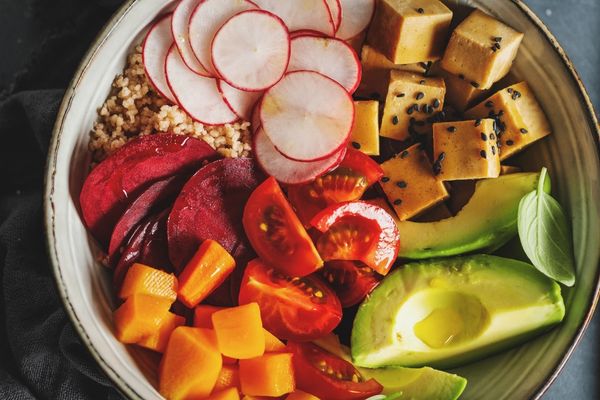 Array of vegetables on a white plate for World Vegan Day