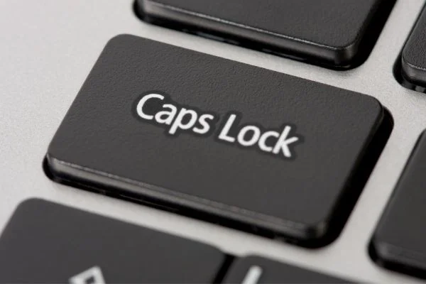 Cap Lock key on a computer keyboard for Caps Lock Day on 22nd October