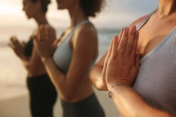 People practicing yoga for World Wellness Weekend every September