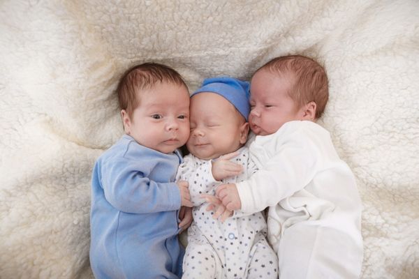 Cute photo of triplet babies cuddling