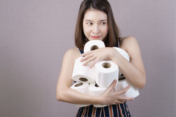 Woman hoards rolls of toilet paper for Toilet Paper Day