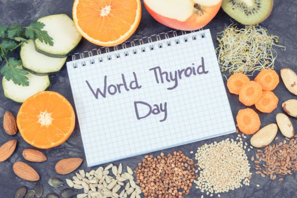 A notepad with World Thyroid Day written on it